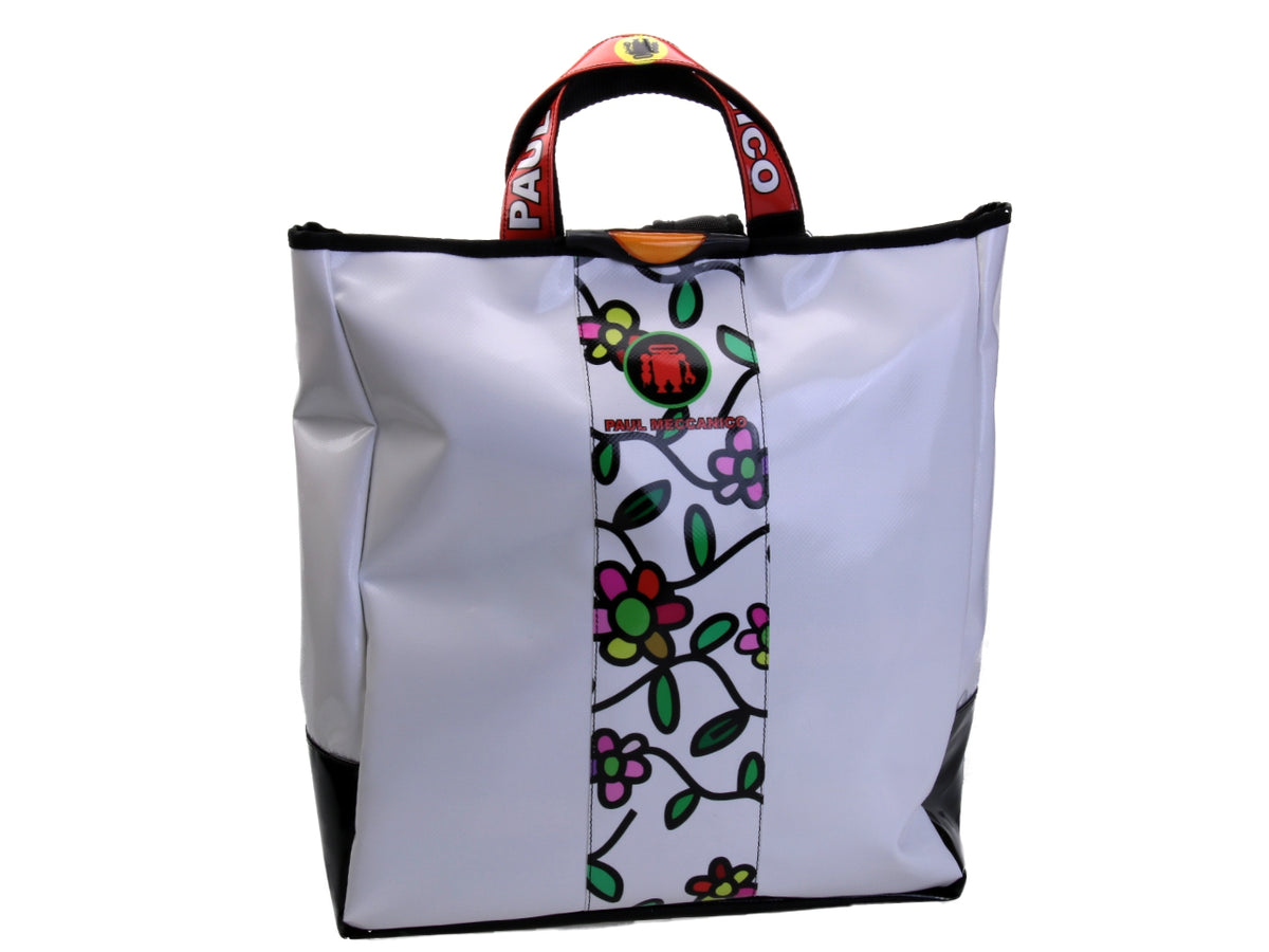 2 IN 1 BRIEFCASE AND BACKPACK WHITE WITH FLORAL FANTASY. MODEL HYBRID MADE OF LORRY TARPAULIN.