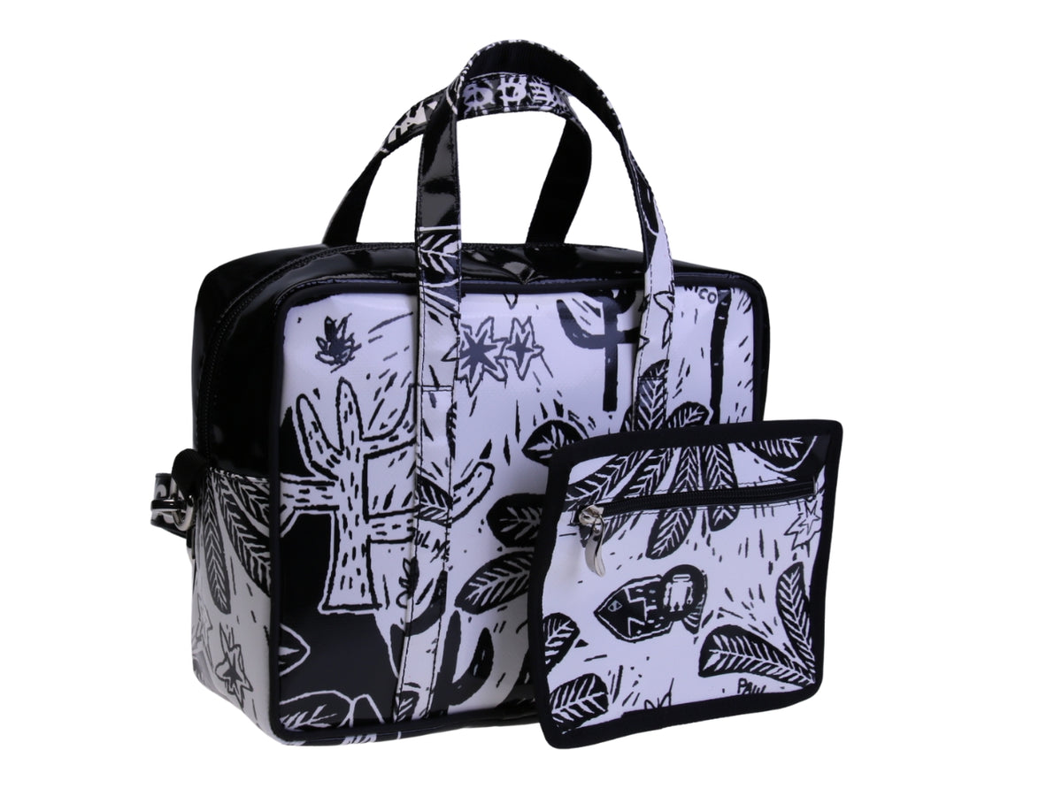 ....BLACK AND WHITE RECTANGULAR WOMEN&#39;S BAG WITH FLORAL FANTASY. MODEL PINCA MADE OF LORRY TARPAULIN.