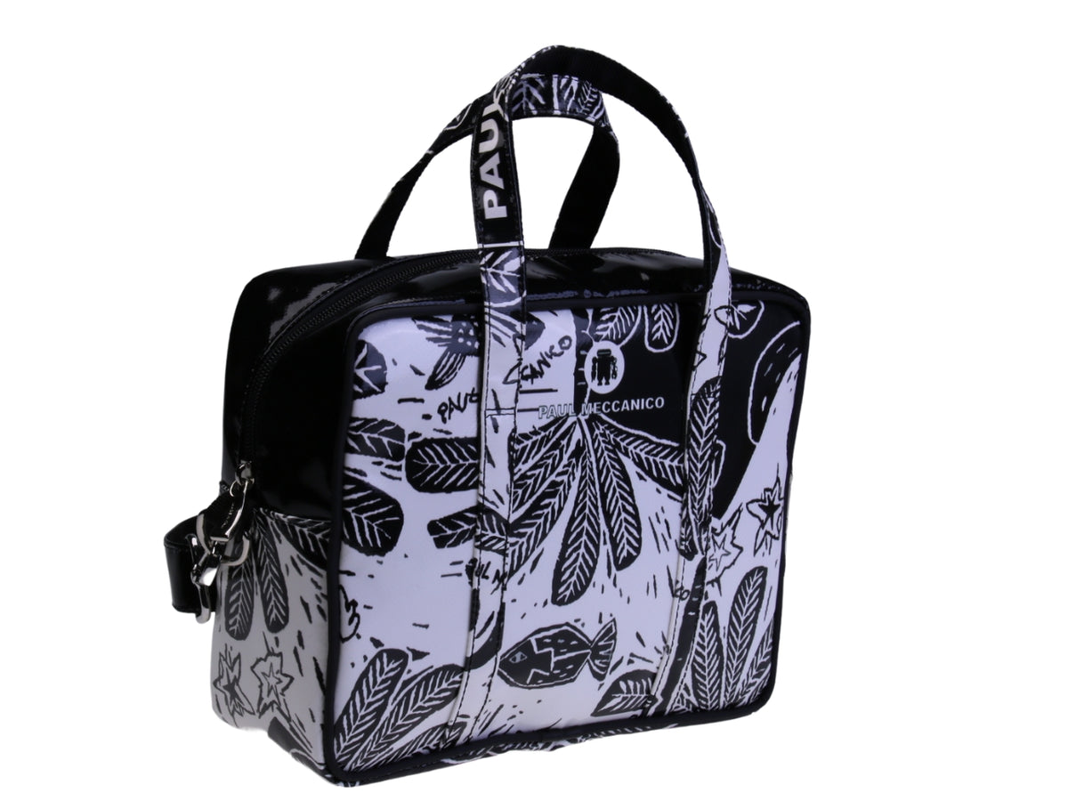 ....BLACK AND WHITE RECTANGULAR WOMEN&#39;S BAG WITH FLORAL FANTASY. MODEL PINCA MADE OF LORRY TARPAULIN.