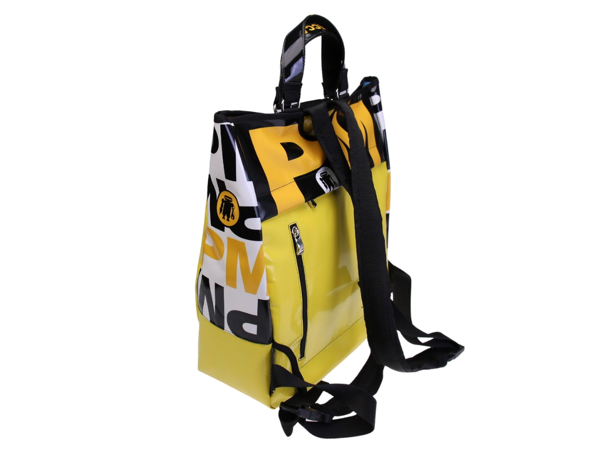 ...2 IN 1 BRIEFCASE AND BACKPACK IN YELLOW COLOUR. MODEL HYBRID MADE OF LORRY TARPAULIN.