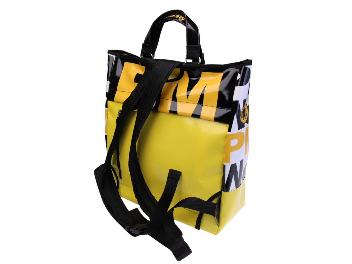 ...2 IN 1 BRIEFCASE AND BACKPACK IN YELLOW COLOUR. MODEL HYBRID MADE OF LORRY TARPAULIN.