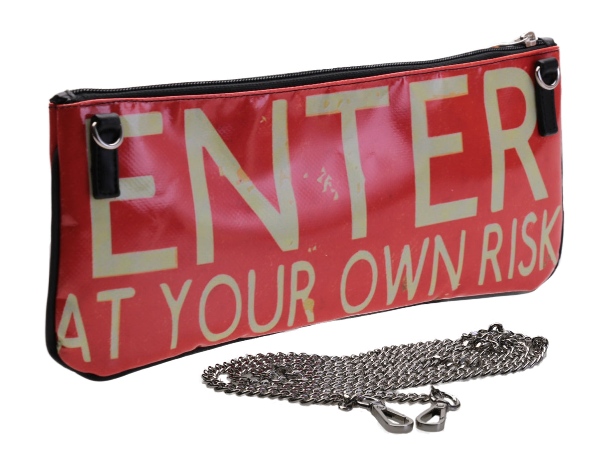 BEIGE AND ORANGE CLUTCH BAG &quot;ENTER AT YOUR OWN RISK&quot;. MODEL RIBELLA MADE OF LORRY TARPAULIN.
