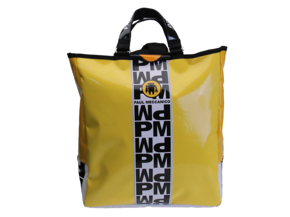 2 IN 1 BRIEFCASE AND BACKPACK IN YELLOW WITH BLACK AND WHITE LETTERING. MODEL HYBRID MADE OF LORRY TARPAULIN.