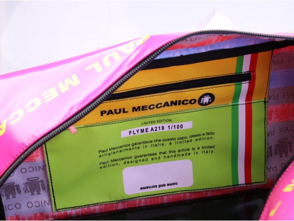 FUCHSIA HAND LUGGAGE BAG 40 X 20 X 25 CM. MODEL FLYME MADE OF LORRY TARPAULIN.