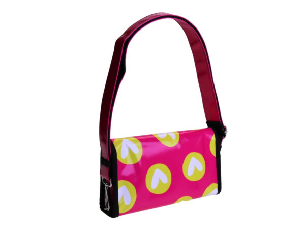 ...FUXIA CLUTCH BAG "HEARTS". MODEL CANDY MADE OF LORRY TARPAULIN.