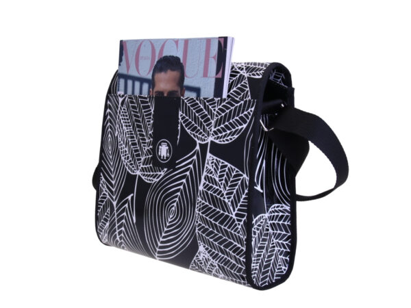 _ CROSSBODY BAG BLACK & WHITE WITH FLORAL FANTASY. MODEL BREAK MADE OF LORRY TARPAULIN.